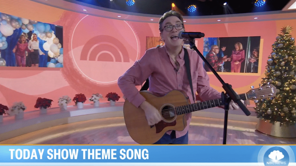 Rob playing his guitar and singling at live performance in Today Show Studio